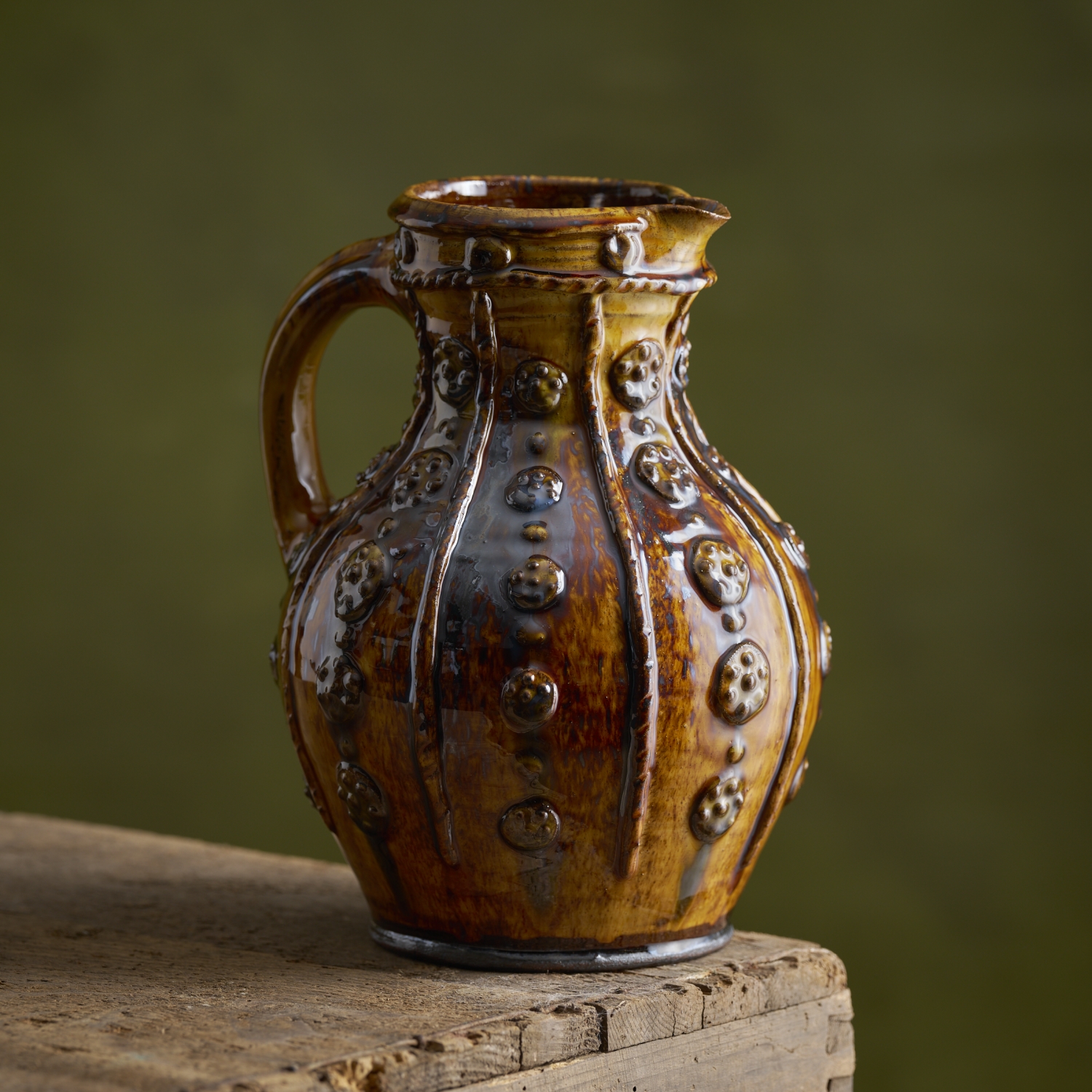 Round bellied applique jug